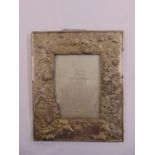 A Japanese rectangular metal repousse photo frame