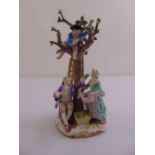 A Meissen figural group of figures picking apples on shaped circular base A/F