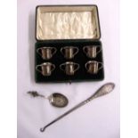 A quantity of silver to include a cased set of six shot cups in the form of tygs, a caddy spoon