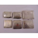 A quantity of silver cigarette cases and silver mounted aide memoirs (6)