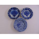 Three oriental blue and white chargers decorated with flora and fauna