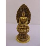 An oriental brass figurine of a Guanyin on raised lotus leaf base