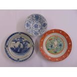Three Chinese porcelain dishes decorated with figures and stylised vegetation