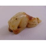 A Chinese mutton fat jade carving of a lion