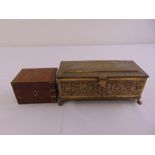 A rectangular brass presentation casket decorated with landscapes, the raised hinged cover with