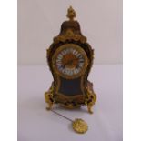 Louis Eschholz Boule mantle clock, gilded dial and Roman numerals with bud finial and four scroll