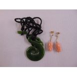 A pair of 9ct gold and coral earrings and a jadeite brooch on a string necklace
