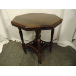An Edwardian octagonal mahogany gallery side table on turned legs and castors