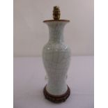 A Chinese Ge type crackle glaze baluster vase converted to a table lamp mounted on a pierced