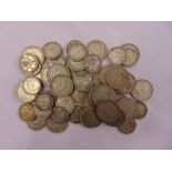 A quantity of pre 47 silver coins to include two shillings and one shilling coins