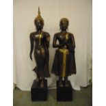 Two early 20th century cast bronze Thai figures highlighted with gilt wash on rectangular base, a.