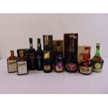 A quantity of alcohol to include Remy Martin, Courvoisier, Otard cognac, Grand Marnier, Cointreau,