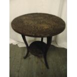 An oriental circular side table on three outswept legs