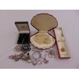 A quantity of silver and costume jewellery to include rings, brooches, necklaces and a charm