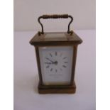 Mathew Norman brass carriage clock of customary form, white enamel dial with Roman numerals