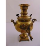 A late 19th century continental brass Samovar of compressed globular form with spigot, two side