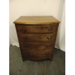 A mahogany rectangular four drawer chest with brass handles on bracket feet