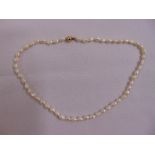 A freshwater pearl necklace with 9ct gold clasp