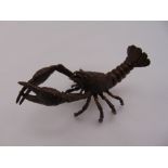 Japanese Meji period bronze figurine of a spiny lobster, signed to the base, 5cm x 9.5cm x 4cm