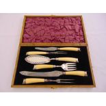 A Victorian oak cased bone handled and silver plated carving set with silver ferules and