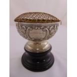 A silver presentation rose bowl the sides chased with flowers and leaves on raised circular base