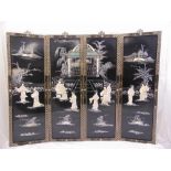A set of four Chinese ebonised wall panels depicting exterior scenes inlaid with mother of pearl and