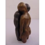 A cast bronze two part figurine of a man and lady, 20.5cm (h)