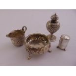 A quantity of silver to include a cream jug, two pepperettes A/F and a Victorian salt, approx