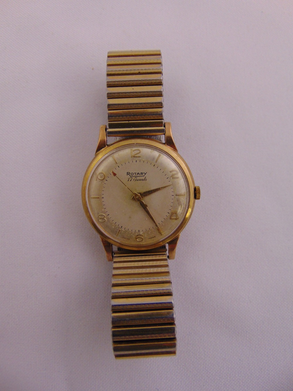 Rotary gentlemans 9ct gold wristwatch on an gold plated expanding bracelet