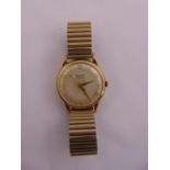 Rotary gentlemans 9ct gold wristwatch on an gold plated expanding bracelet