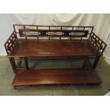 Chinese rectangular hardwood daybed with pierced carved back and matching footstool