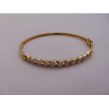 9ct yellow gold and diamond bangle, approx total weight 7.9g