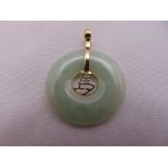 A Chinese jade and 14ct yellow gold pendant