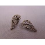 A pair of white gold and diamond Art Deco clip-on earrings, tested 18ct approx total weight 6.0g