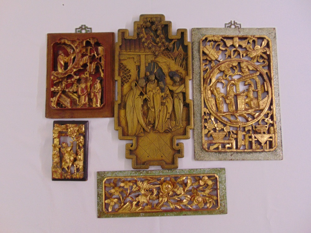 Five far eastern rectangular carved panels depicting figures, flora and fauna