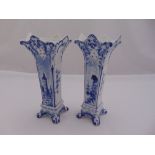 A pair of Delft blue and white shaped rectangular vases on scroll feet, 22cm (h)
