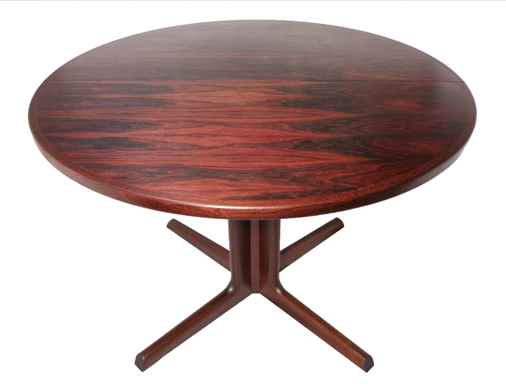 A mid 20th century rosewood circular pedestal dining table by Gudme M›belfabrik of Denmark on