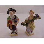 Two Meissen figurines of children in 18th century attire on rectangular bases, marks to the bases,