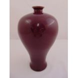 A Chinese oxblood red baluster vase on circular foot with everted rim, 33cm (h)