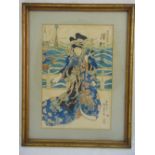 A framed Japanese polychromatic etching of a Geisha, signed top and bottom to the right, 36.5 x 24.