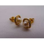 A pair of 18ct yellow gold and pearl earrings, approx total weight 3.0g