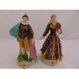 Two figurines of a gentleman and lady in Elizabethan costume on naturalistic plinths, 25.5cm (h)
