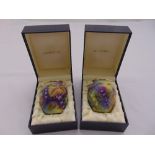 A pair of Moorcroft miniature vases decorated with fruits and leaves in original packaging, both