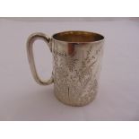 A Victorian silver Christening mug, tapering cylindrical with C shaped handle, the sides engraved
