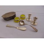 A quantity of silver to include a pair of dwarf candle sticks and silver mounted salts (7)