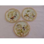 A set of three cabinet plates decorated with birds and flowers in the aesthetic style, 23.5cm