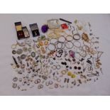 A quantity of silver and costume jewellery to include bangles, earrings, bracelets, brooches, rings,