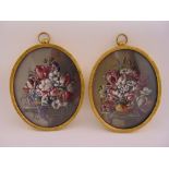 A pair of 17th century Dutch style hand painted miniature still life of flowers in oval gilded metal