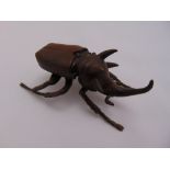Japanese Meji period bronze figurine of a beetle, the hinged back shell lifting to reveal a hollow