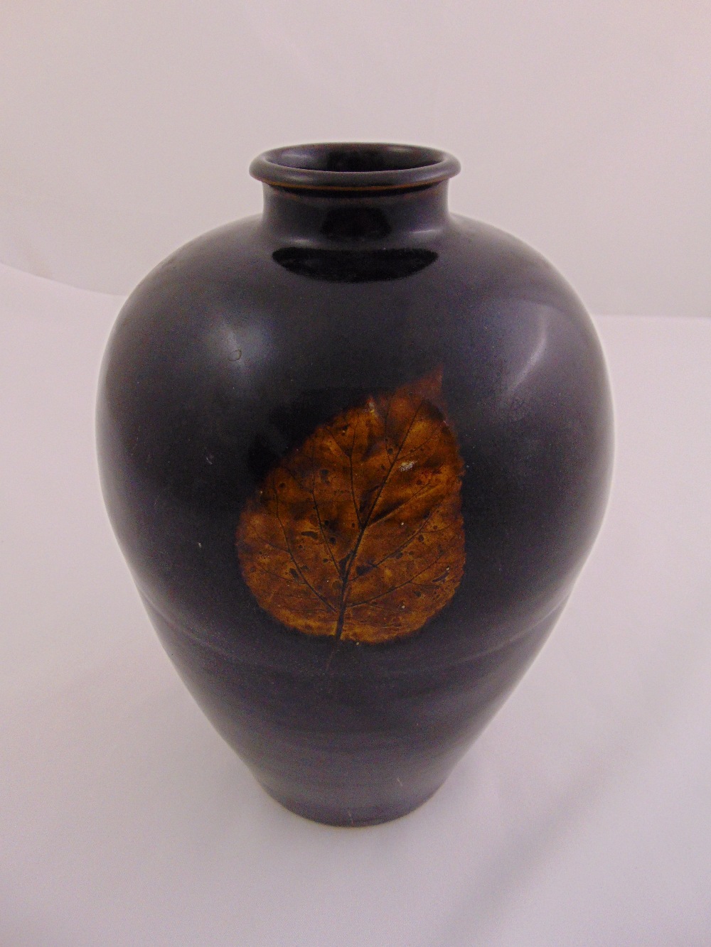 A Chinese Jiangware baluster vase with three leaf decorations to the sides, 29.5cm (h)